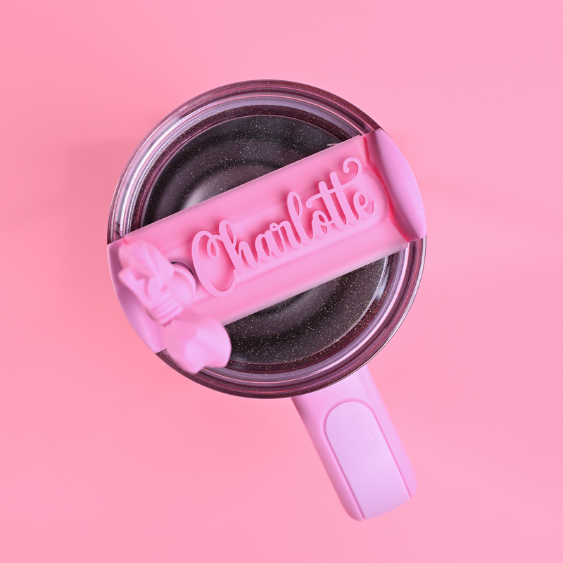 Stanley loveshackfancy ibiza sunset quencher with a baby pink topper tag