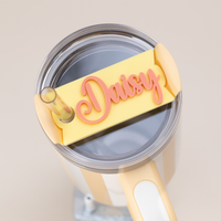 Topper Tag perfect pair Stanley Butter Cabana Gloss Quencher showing custom name tag attachment in pina colada