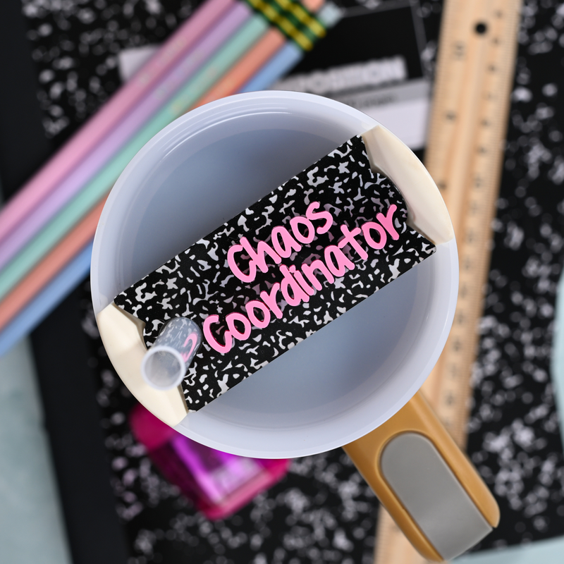 Topper Tag composition book for Stanley Quencher showing custom name tag attachment that reads "Chaos Coordinator"