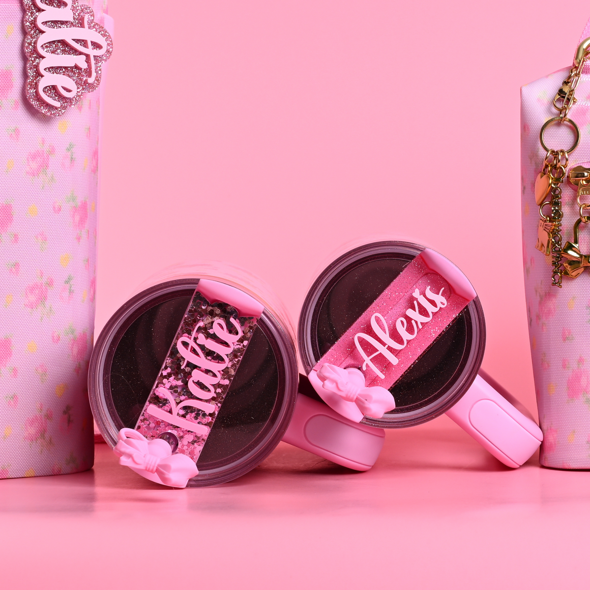 Stanley loveshackfancy ibiza sunset quencher with a pink shimmer and pink glitter topper tag