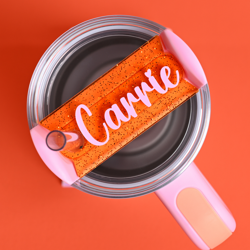 Spellcast Pink Stanley with a topper tag in orange shimmer