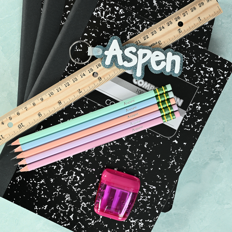 Pastel personalized pencils showing custom name stamping in metallic foil