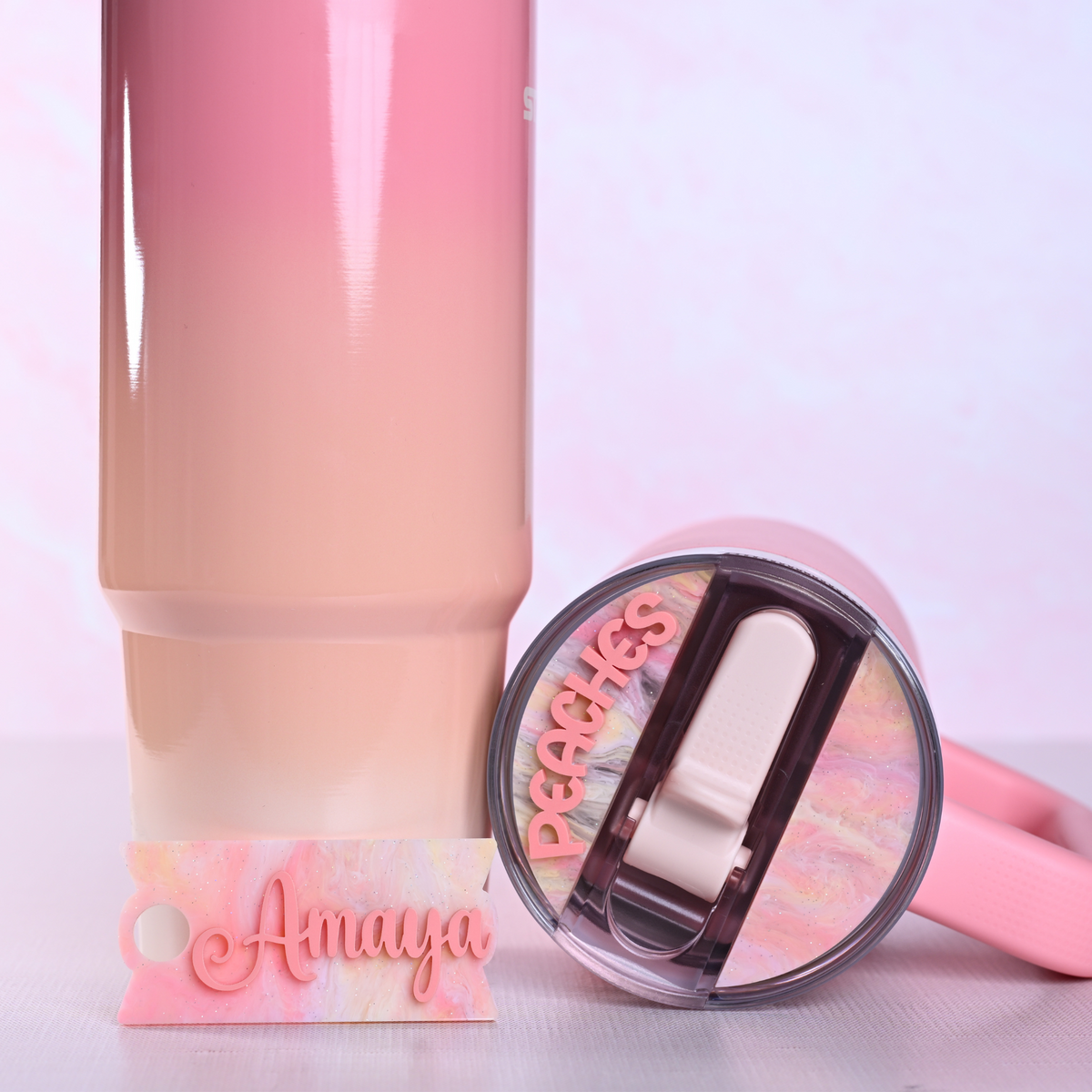 Topper Tag perfect pair Stanley Pink Mesa Quencher and ProTour showing custom name tag attachment that reads "Amaya" and "Peaches"