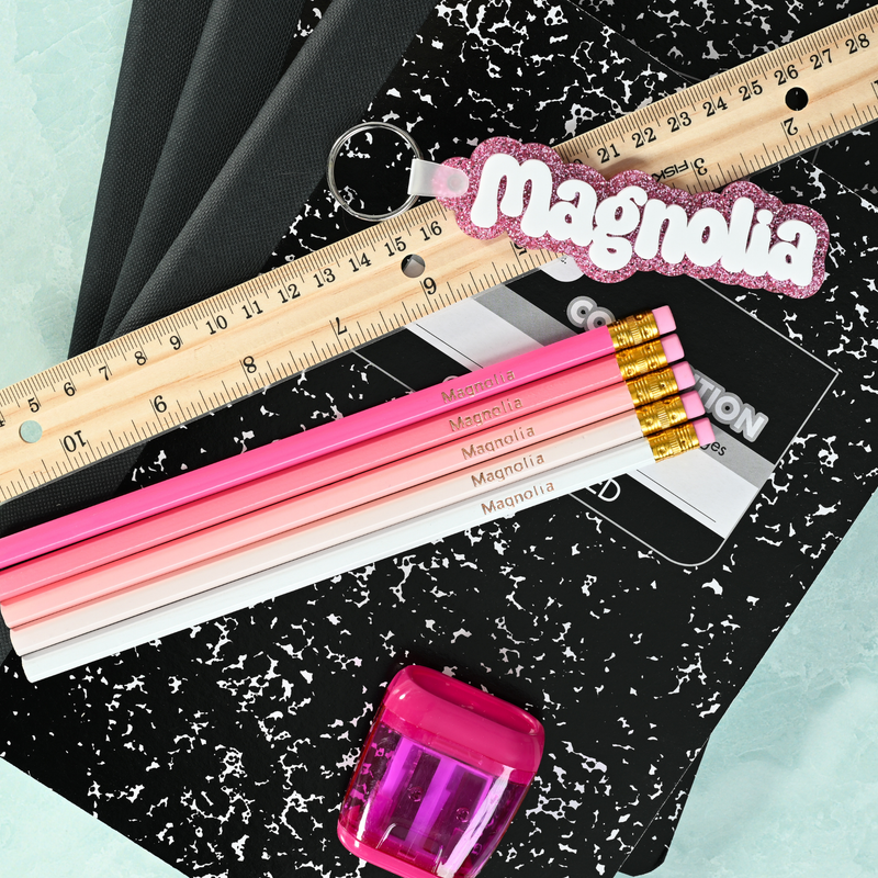 Pink ombre personalized pencils showing custom name stamping in metallic foil