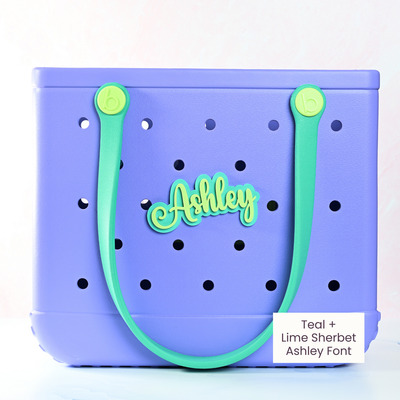 Personalized boggy button Custom Tote Bag Charm attached to a bogg bag with green boggy button on emerald green glitter