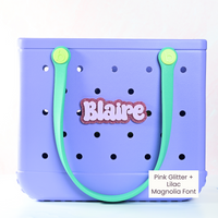 Personalized boggy button Custom Tote Bag Charm attached to a bogg bag with pink glitter boggy button