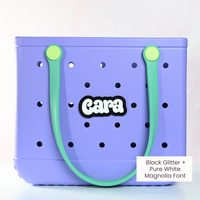 Personalized boggy button Custom Tote Bag Charm attached to a bogg bag with black glitter boggy button