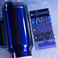 Blue metallic mug with decorative name tags on a light blue background