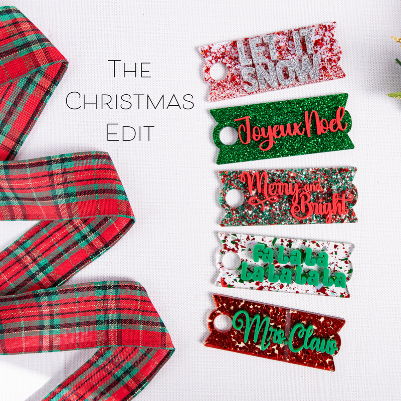 A collection of personalized Christmas-themed topper tags in various designs and colors, intended for Stanley H2.0 Quencher tumblers.