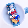 Funny 4th of July Topper Tag showing red white blue stars design with 'suns out buns out' humor for Stanley Quencher