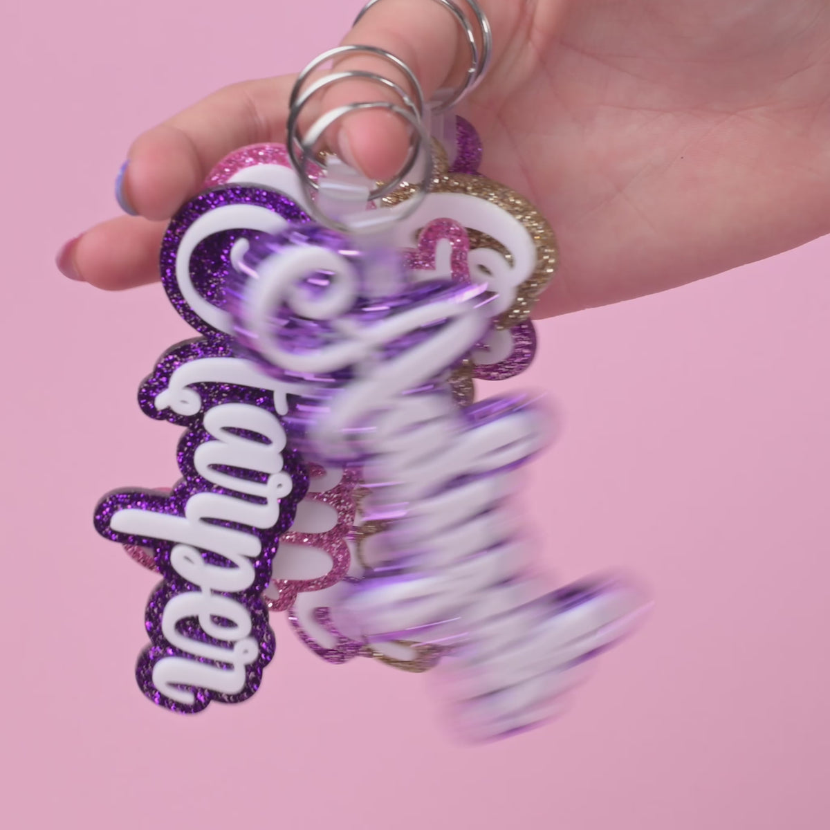 Personalized bag tags showing custom name engraving on durable acrylic with key ring attachment