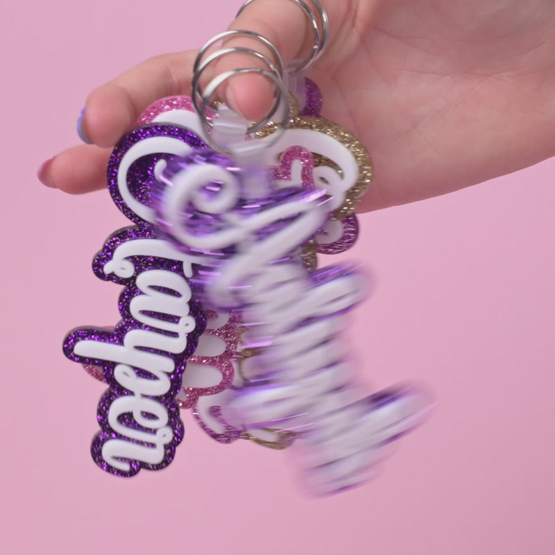 Personalized bag tags showing custom name engraving on durable acrylic with key ring attachment